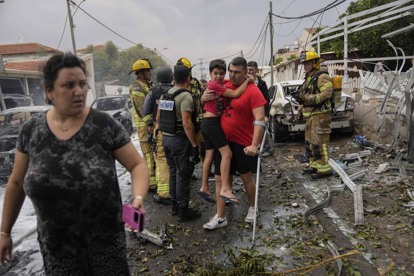 Israelis evacuate a site struck by a rocket fired from the Gaza Strip, in Ashkelon, southern Israel, on October 9. Photo / AP