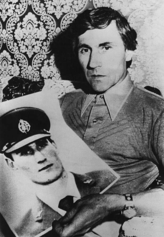 Guido Valentich holds a photograph of his son Frederick, a pilot who went missing while on a flight to King Island in a Cessna in October 1978. Photo / Getty