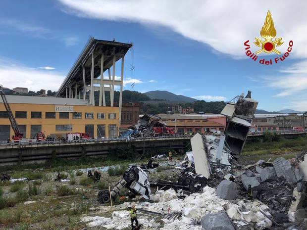 Italian firefighters, firefighters work among the rubble of the collapsed Morandi highway bridge in Genoa, northern Italy. Photo / AP