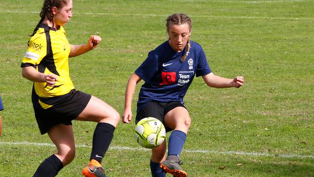 Stella Warner was part of a strong back four for Whanganui whose defence let in only one goal on Sunday. Here she tries to get the ball past Feilding's Louise Thompson. Photo / Bevan Conley