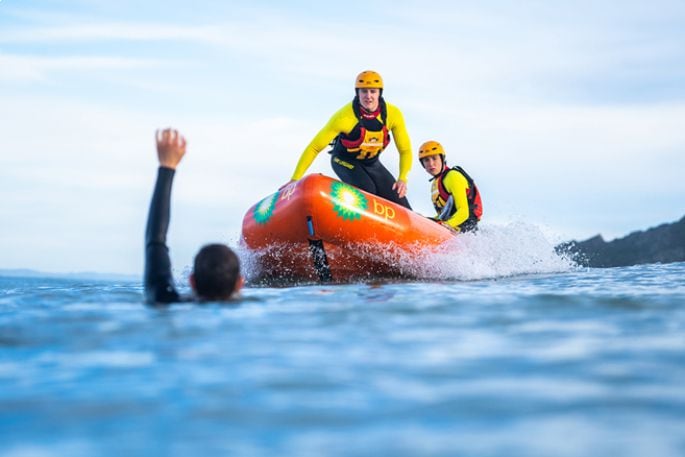 Surf Life Saving New Zealand lifeguards using an Inflatable Rescue Boat (IRB). Photo / SLSNZ
