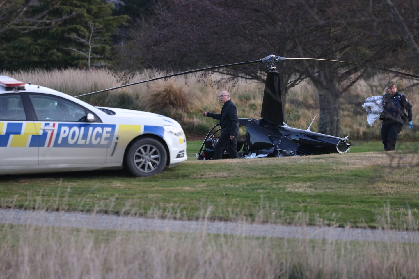 The tail of the Robinson 44 helicopter was sheared off in a crash which injured all four on board, including a couple about to be married. Photo / George Heard