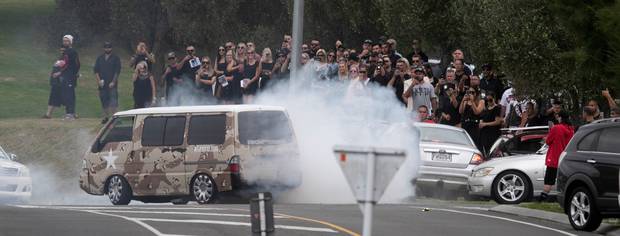 A van doing burnouts at the funeral. Photo / Alan Gibson