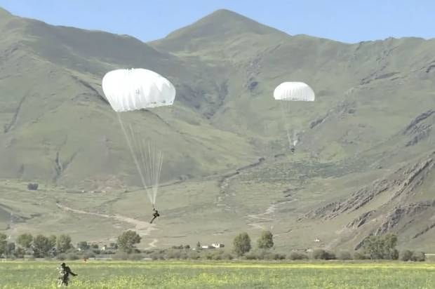 More than 300 Chinese troops parachuted onto the Tibetan plateau recently as part of a training exercise, according to Chinese state media. Photo / Handout