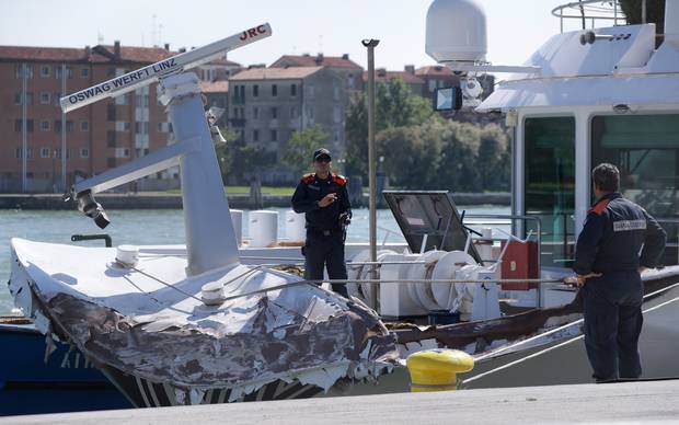 Italian Coast Guard officers inspect the tourist boat that was struck by a cruise ship in Venice. Photo / AP