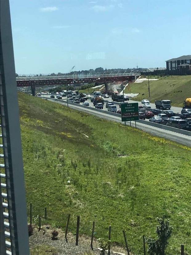 Police cars and an ambulance have been seen heading to the scene on Northern motorway. Photo / Supplied