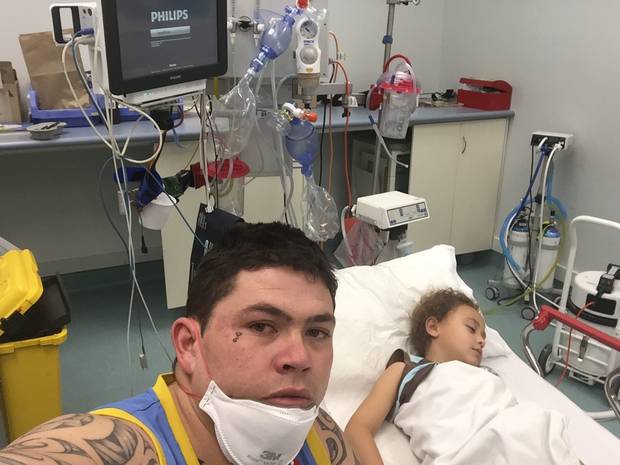 Ted Hansen, 26, with his nephew Tyler Hansen, 6, who suffered an 8cm gash to his right leg after a casserole dish exploded. Photo / Supplied 