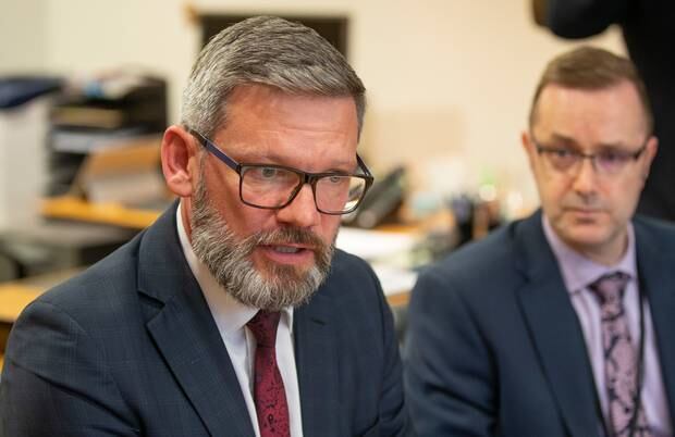 Immigration Minister Iain Lees-Galloway, with Immigration NZ boss Greg Patchell, announcing his decision to deport Sroubek. Photo / Mark Mitchell