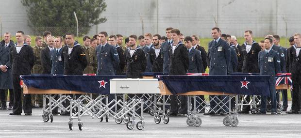 The New Zealand Defence Force with the casket of a child among the returned remains. Photo / Greg Bowker