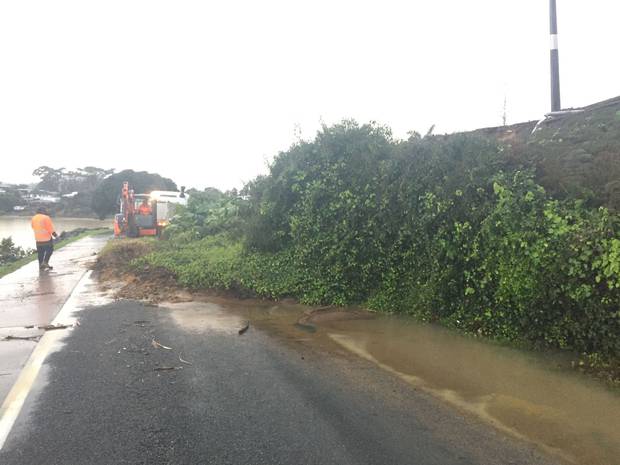 Beach Rd, Onerahi is completely blocked by a slip. A worker who was helping to clear the scene said similar clean-up crews were all across Whangārei clearing other sites.