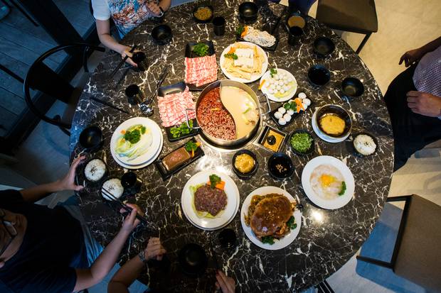 Hotpot dining is being shunned after reports that 10 members of a family in Hong Kong became infected with coronavirus after sharing the dish. Photo / Jason Oxenham.