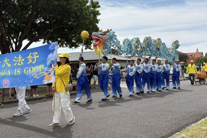 The Falun Dafa group parading in the 2024 Pak'nSave Pāpāmoa Superhero Santa Parade. Photo / Supplied