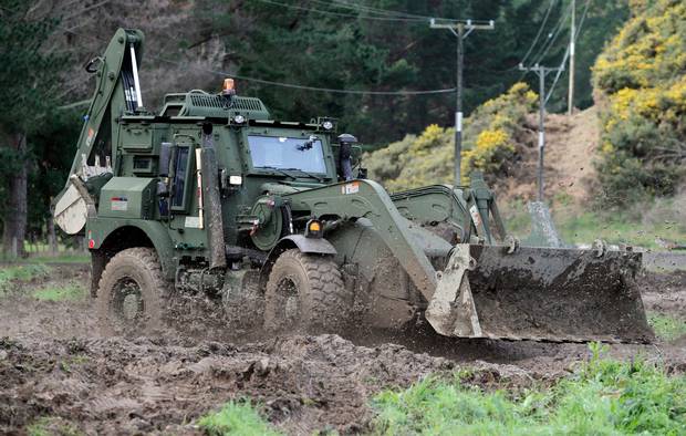 Corporal Marcus Good demonstrates one of the army's an armoured combat tractor at Trentham Camp, Upper Hutt in June 2011. Photo / Mark Mitchell