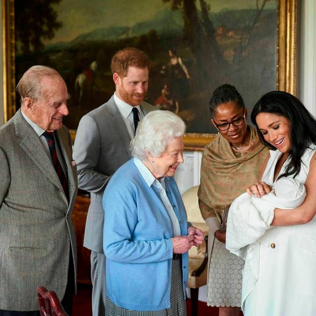 Britain's Prince Harry and Meghan, Duchess of Sussex, joined by her mother, Doria Ragland, show their new son to Queen Elizabeth II and Prince Philip at Windsor Castle. Photo / AP