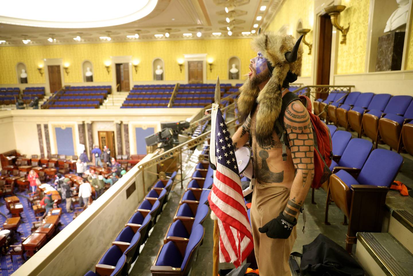 Jake Angeli yells inside the Senate Chamber in Washington. Photo / Getty Images