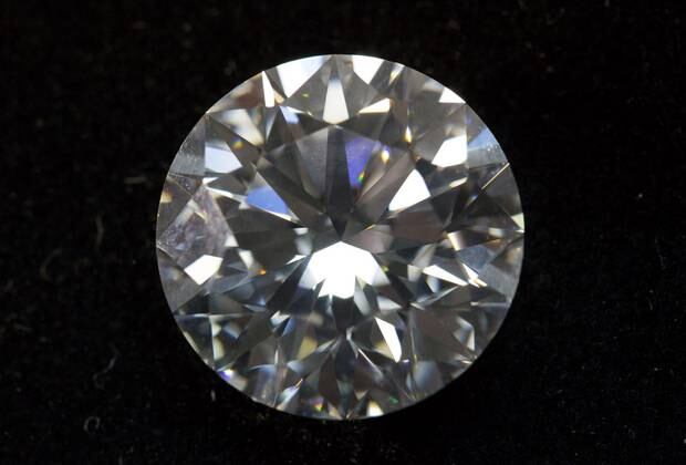A circular 16,95 carat cut diamond sits on display at Alrosa's cutting and polishing unit in Moscow. Photo / Bloomberg and Andrey Rudakov
