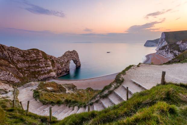 Steps down to Durdle Door, Dorset, England. Photo / Getty Images