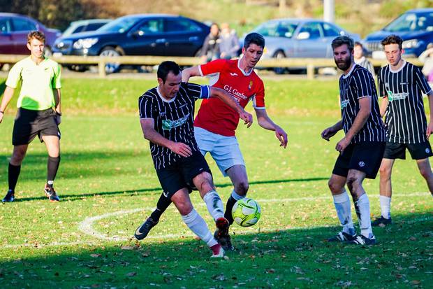 Napier Marist's Jonty Underhill scraps for possession with Atheltic's Jai Stephens. Photo/ Lewis Gardner 