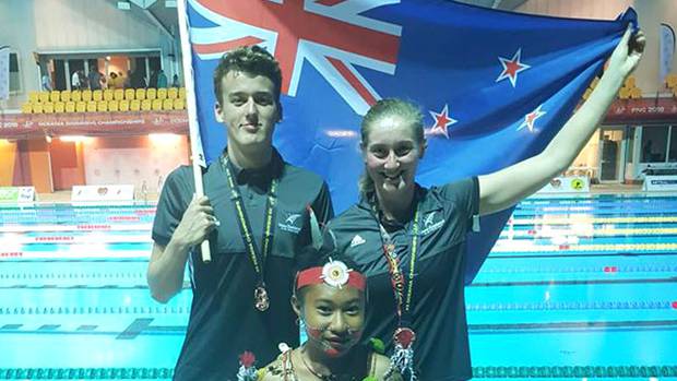 Rotorua's David Boles, left, and Stephanie Gillespie from Otago both won bronze medals in the Open Water 5km races. Photo / Supplied