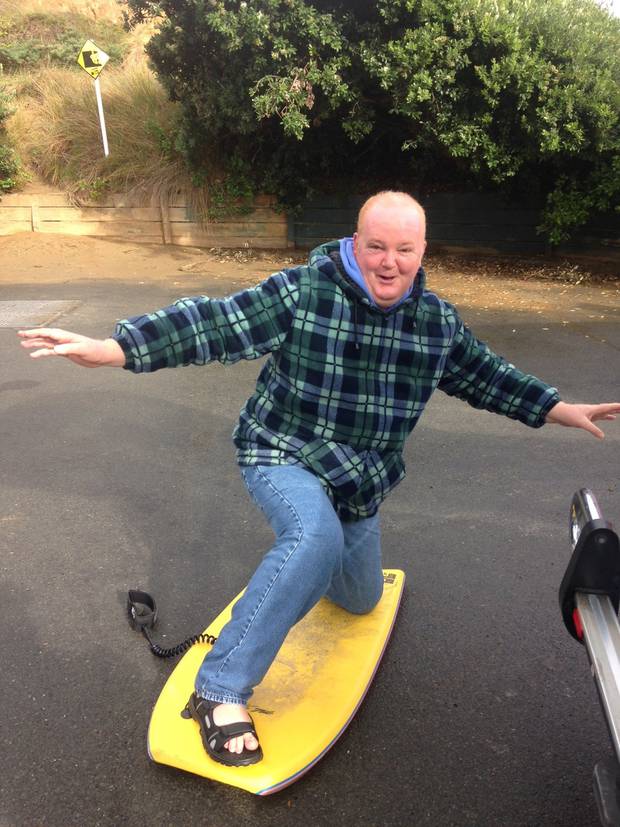 Ashley Peacock on a recent outing. His parents are hoping he'll be able to go surfing again.
