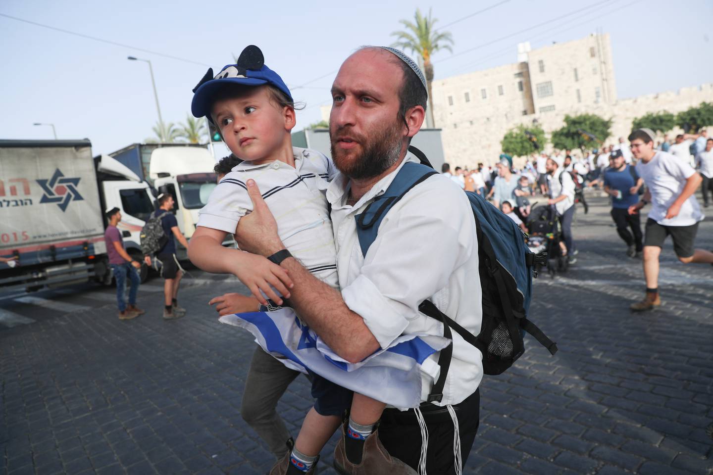 Israelis run to shelters as air attack sirens go off in Jerusalem,. Photo / AP