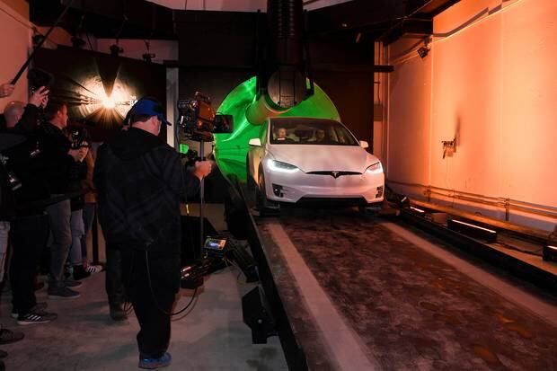 Elon Musk arrives in a modified Tesla Model X at the Hawthorne test tunnel in LA. Photo / AP