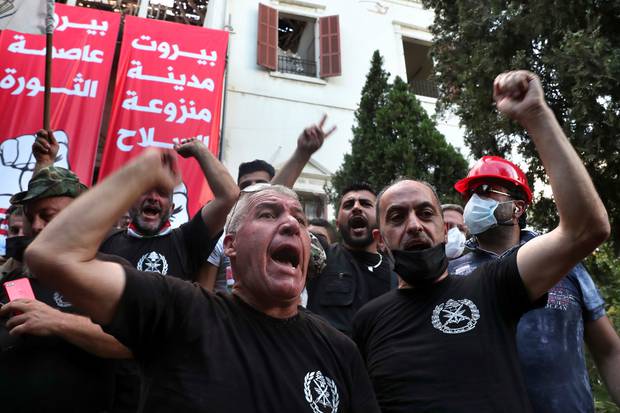 Retired army officers chant slogans inside the Lebanese foreign ministry in Beirut, Lebanon. Photo / AP