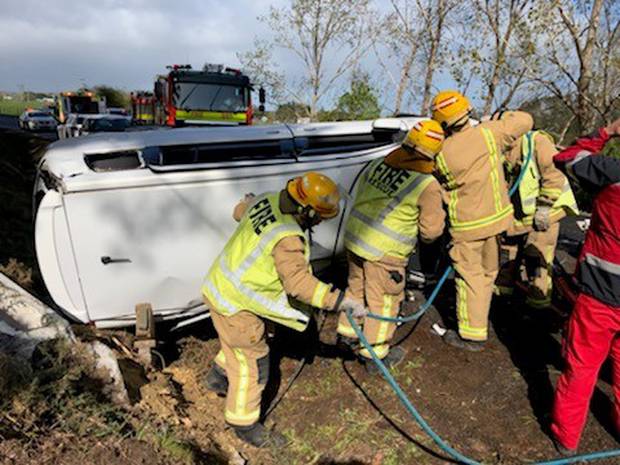 Fire crews work to get man trapped out of vehicle. Photo / Supplied