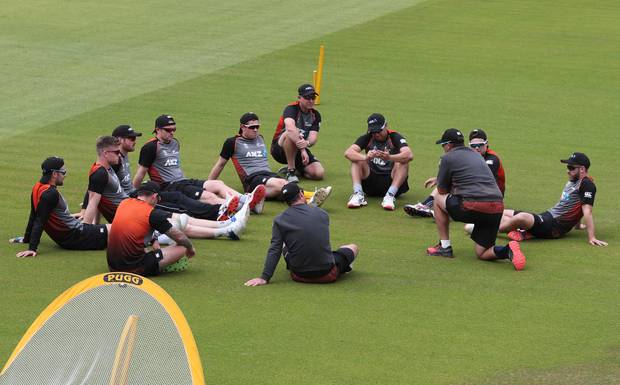 New Zealand's captain Kane Williamson, right, and teammates attend a meeting before a training session ahead of their Cricket World Cup semifinal match against India. Photo / AP