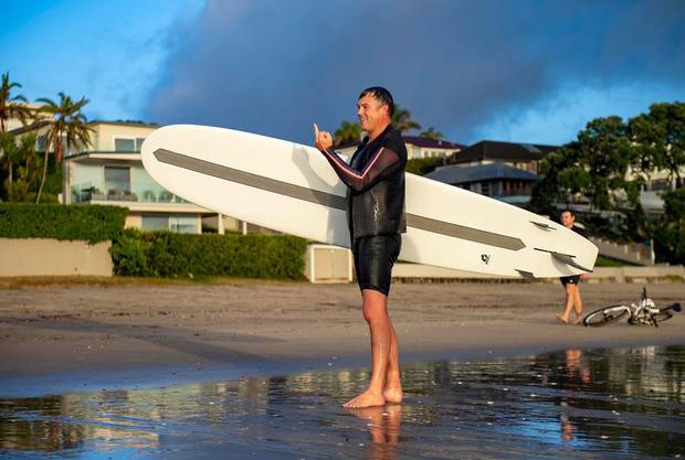 A man reacts after a heated conversation about him breaching the Covid-19 lockdown rules by surfing this morning. Photo / Supplied