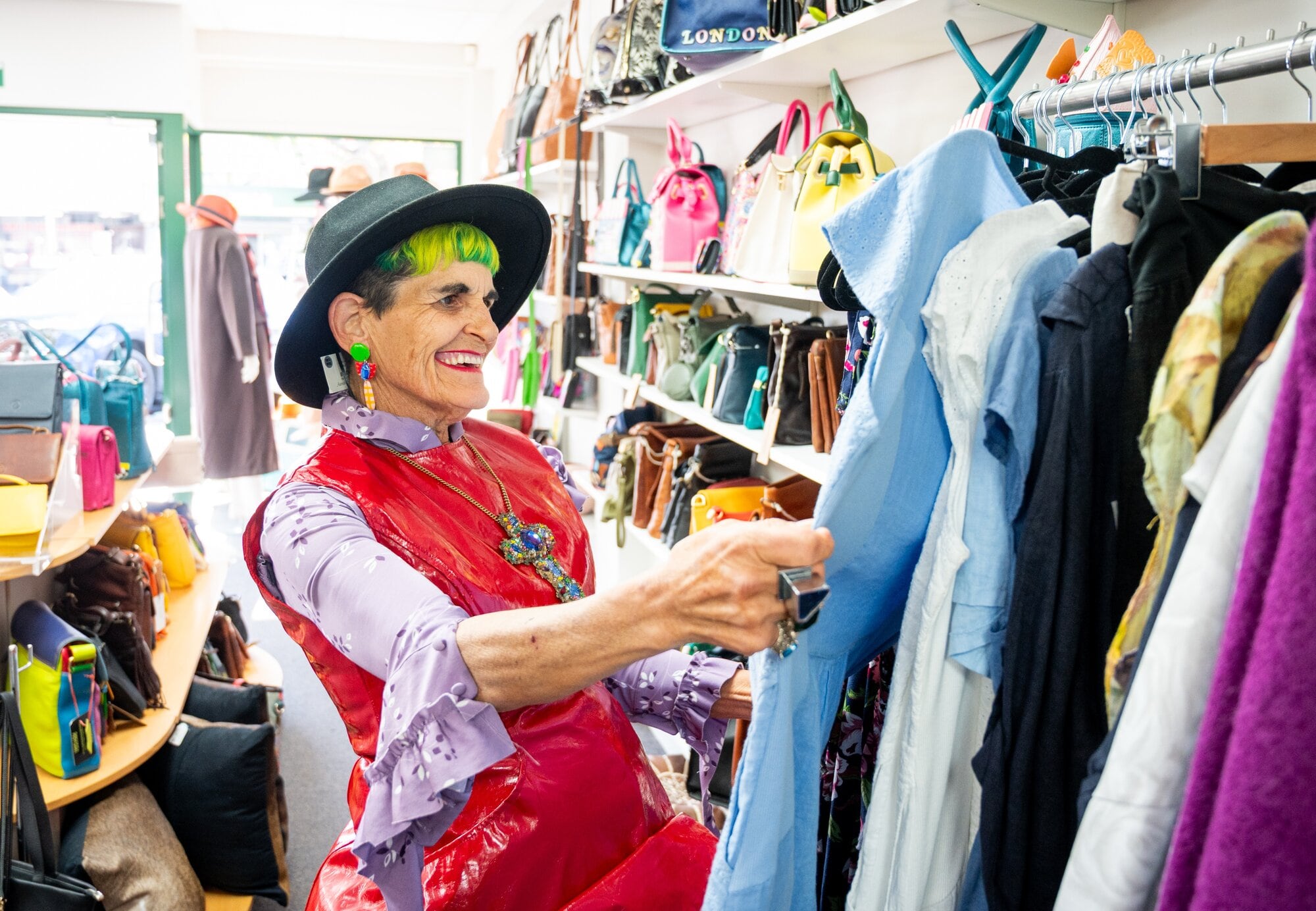  Mary Borman, owner of High St Boutique, will be one of the judges for the Greerton Retro Fest Op-Shop Challenge, seen here amongst the bags, hats and accessories at MDS Leatherworks in Greerton Village. Photo / Brydie Thompson