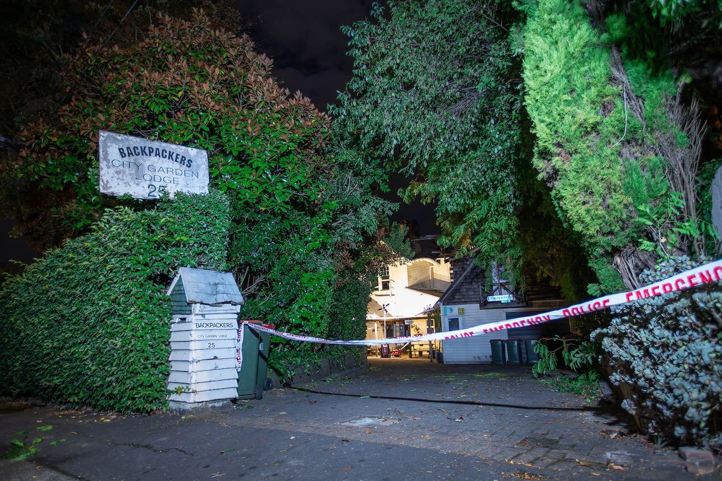 A police guard remains outside City Garden Lodge on St Georges Bay Road in Parnell following yesterday's fire. Photo / Hayden Woodward