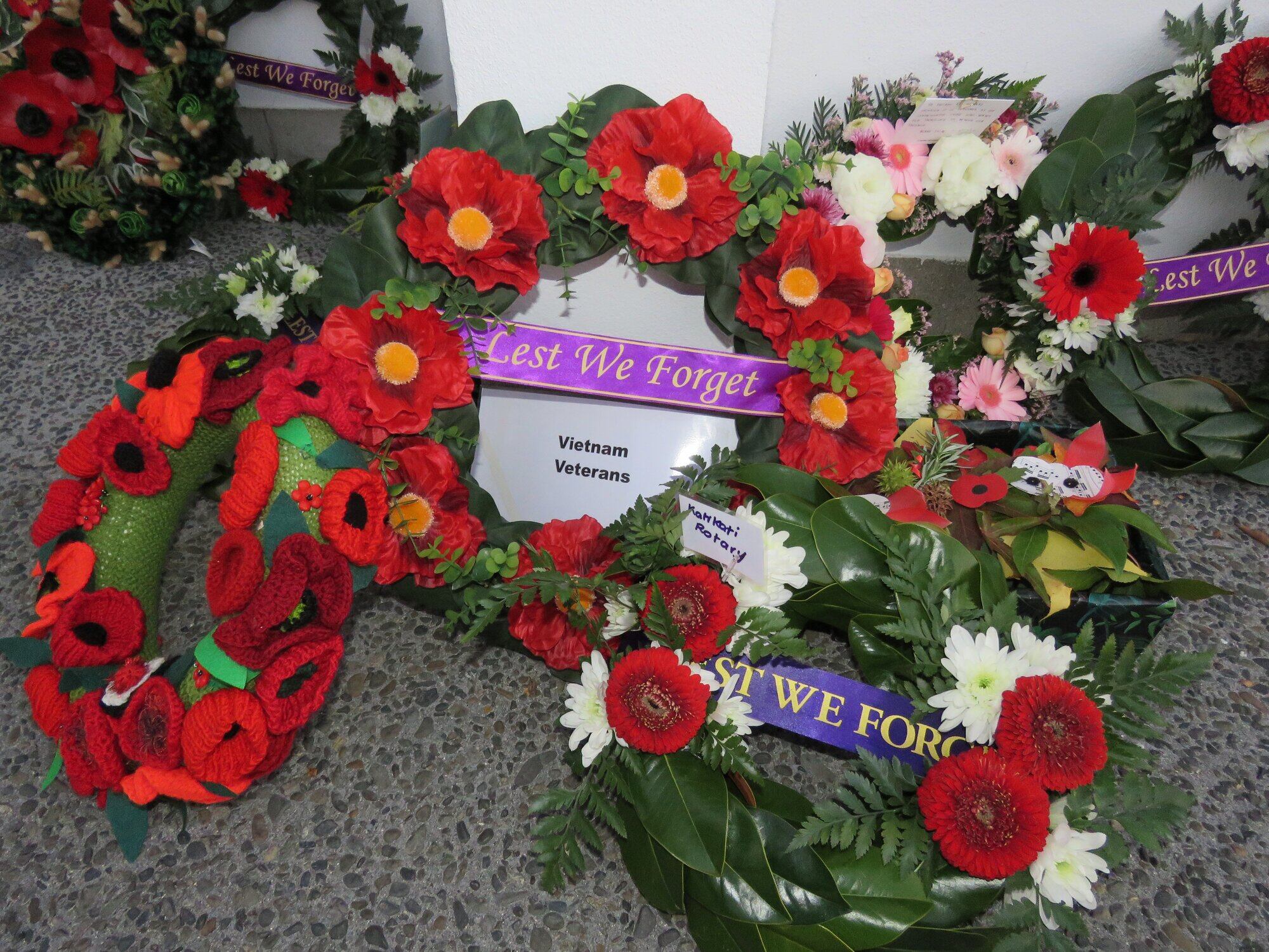  Poppy-laden wreaths left beneath the Rolls of Honour from Katikati&rsquo;s Dawn Service. Photo / Merle Cave