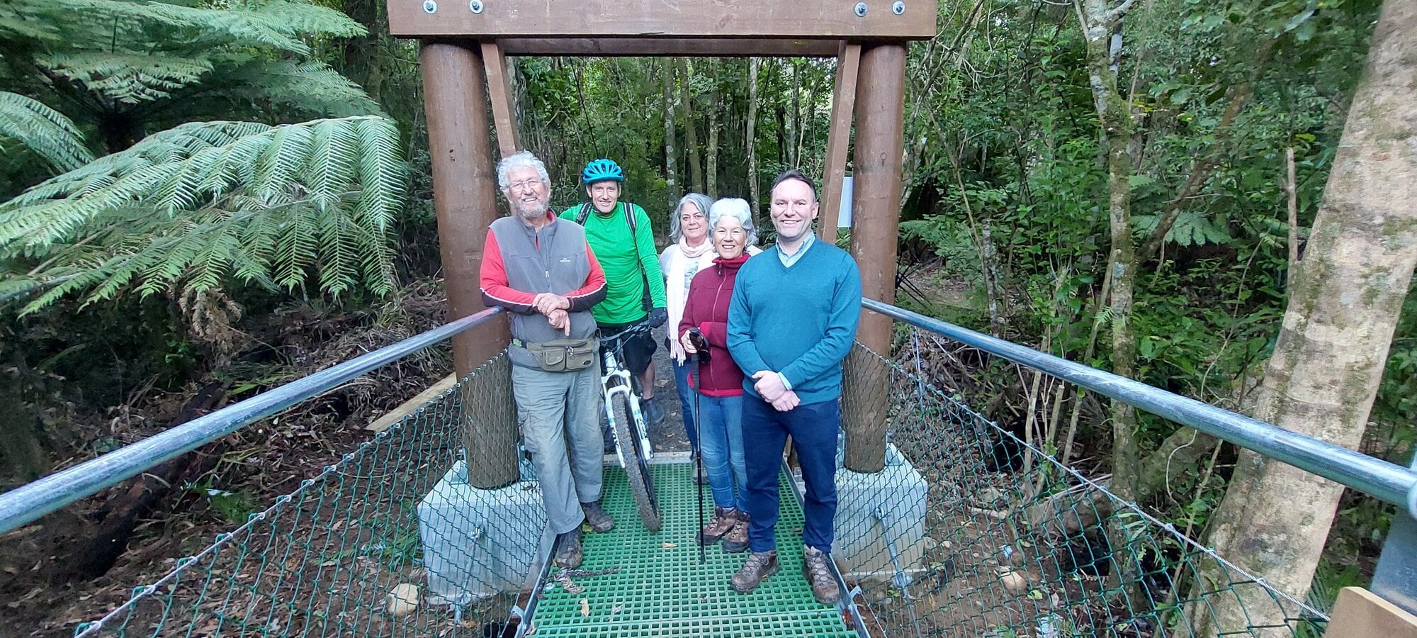  Lawrie Macdonald, Damon McLachlan, Jacqui Knight, Jill Jackson and Western Bay Mayor James Denyer on the new bridge. Photo / Supplied