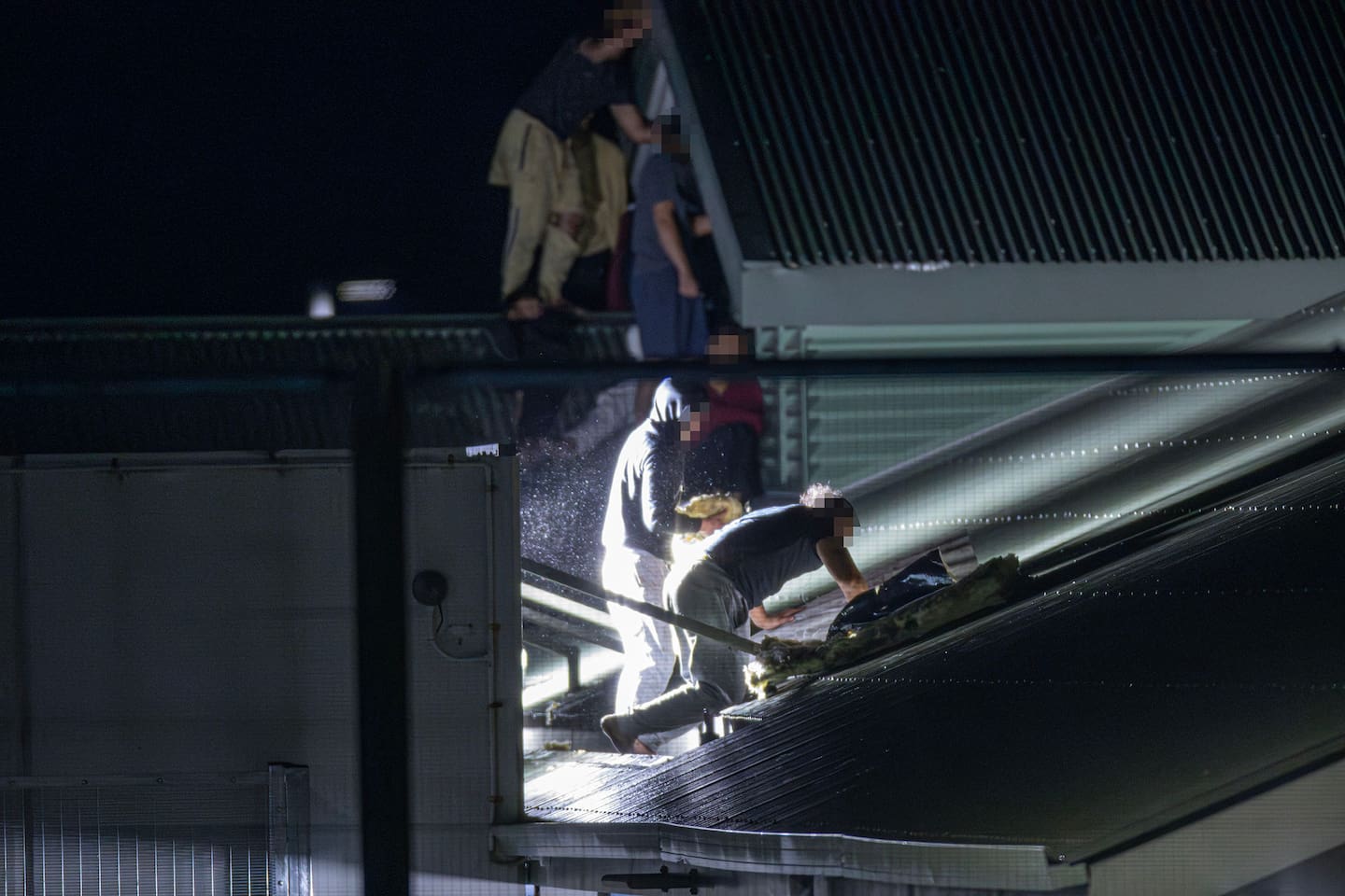 13 young people have gained access to the roof of its Wiri facility last night. Photo / Hayden Woodward.