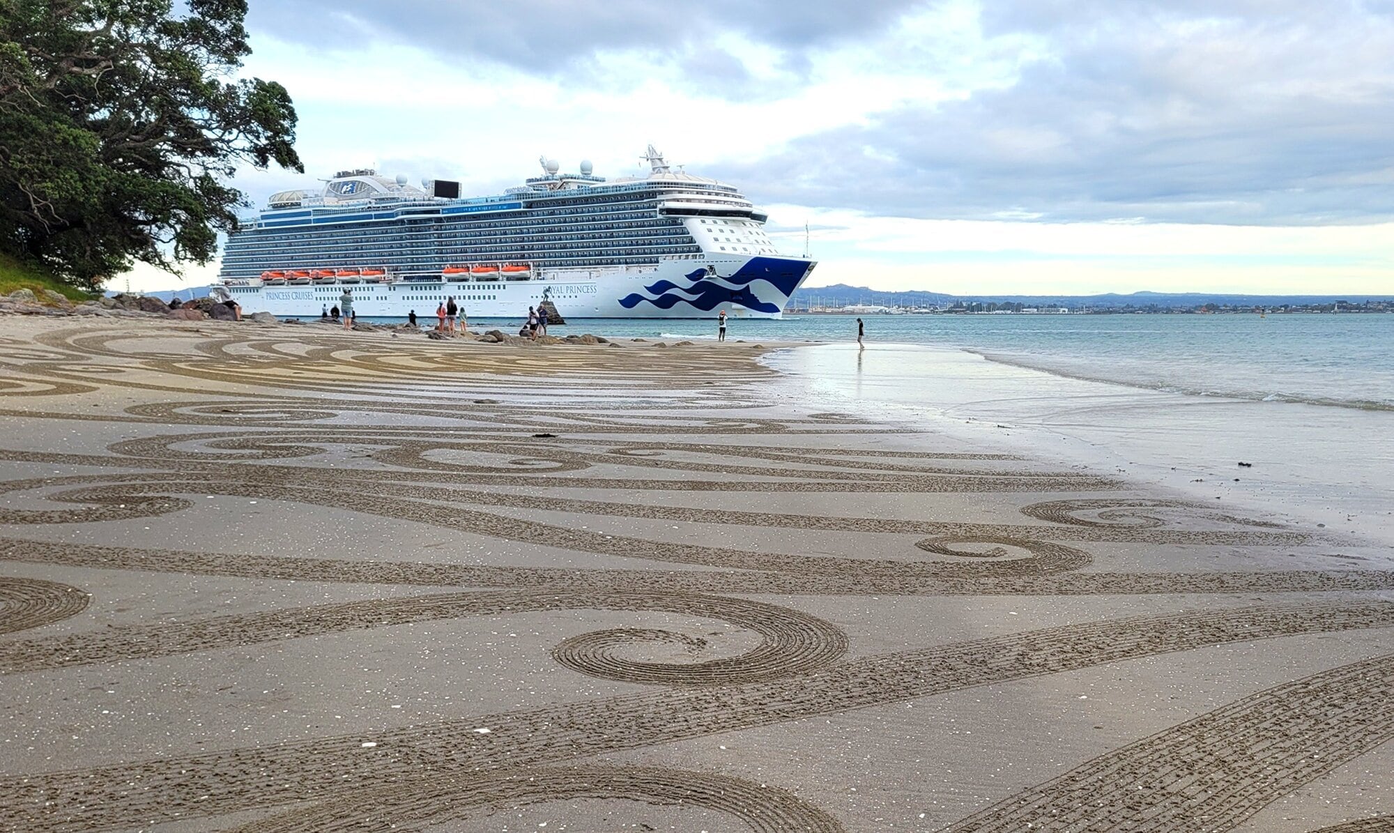 Raked sand drawings farewell passengers aboard the Royal Princess as it departs Tauranga Harbour on Tuesday, April 15. Photo / Nikki Moloney