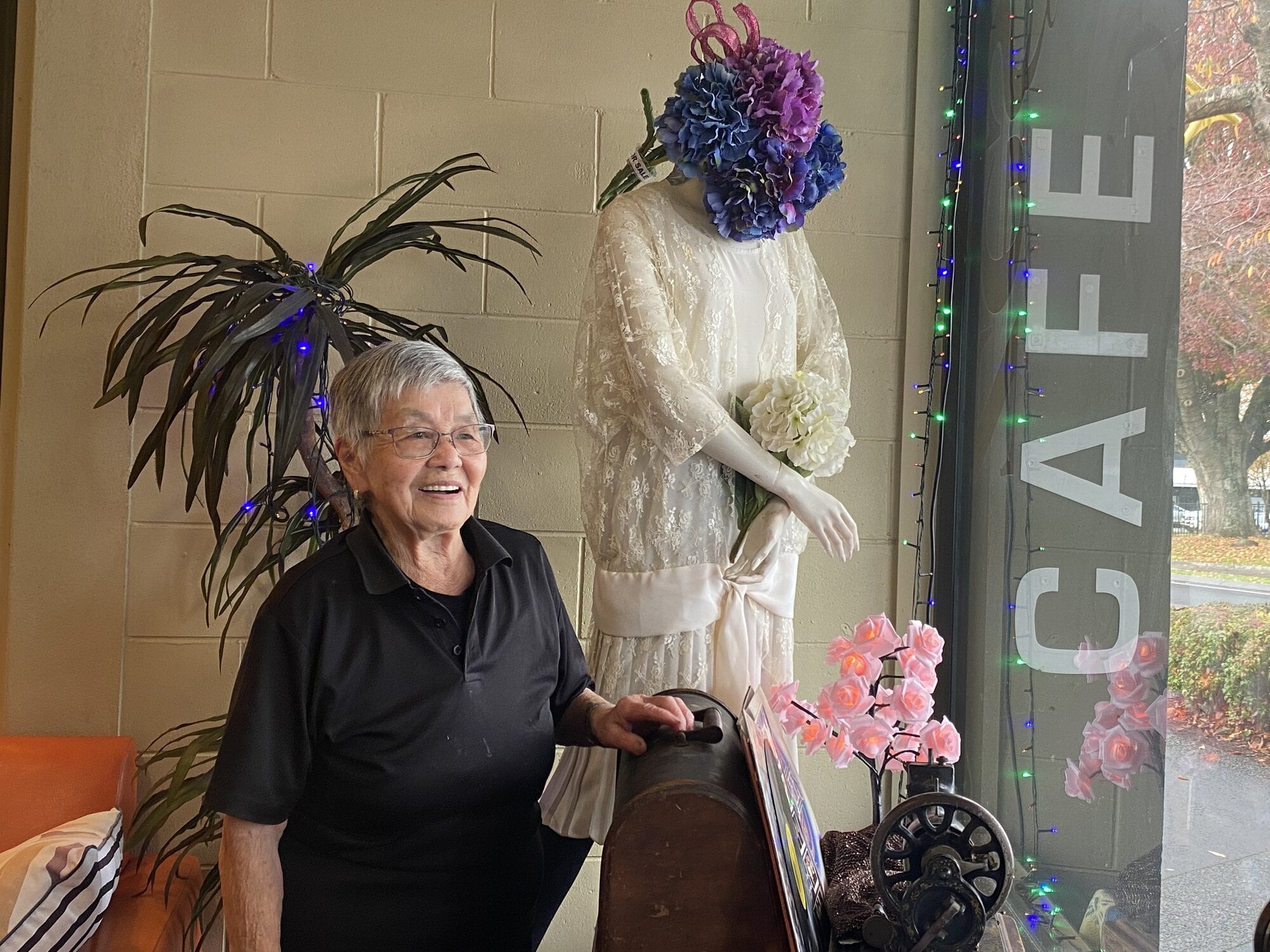 Zest Café and Bakery owner Kay Perry with their retro window display. Photo/Rosalie Liddle Crawford.