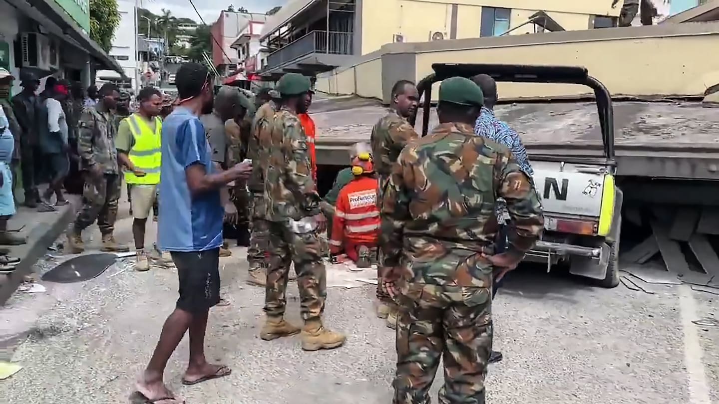 Damage to buildings and the first attempts at recovery in Port Vila after the a 7.3 magnitude quake struck yesterday. Photo / Michael Thompson