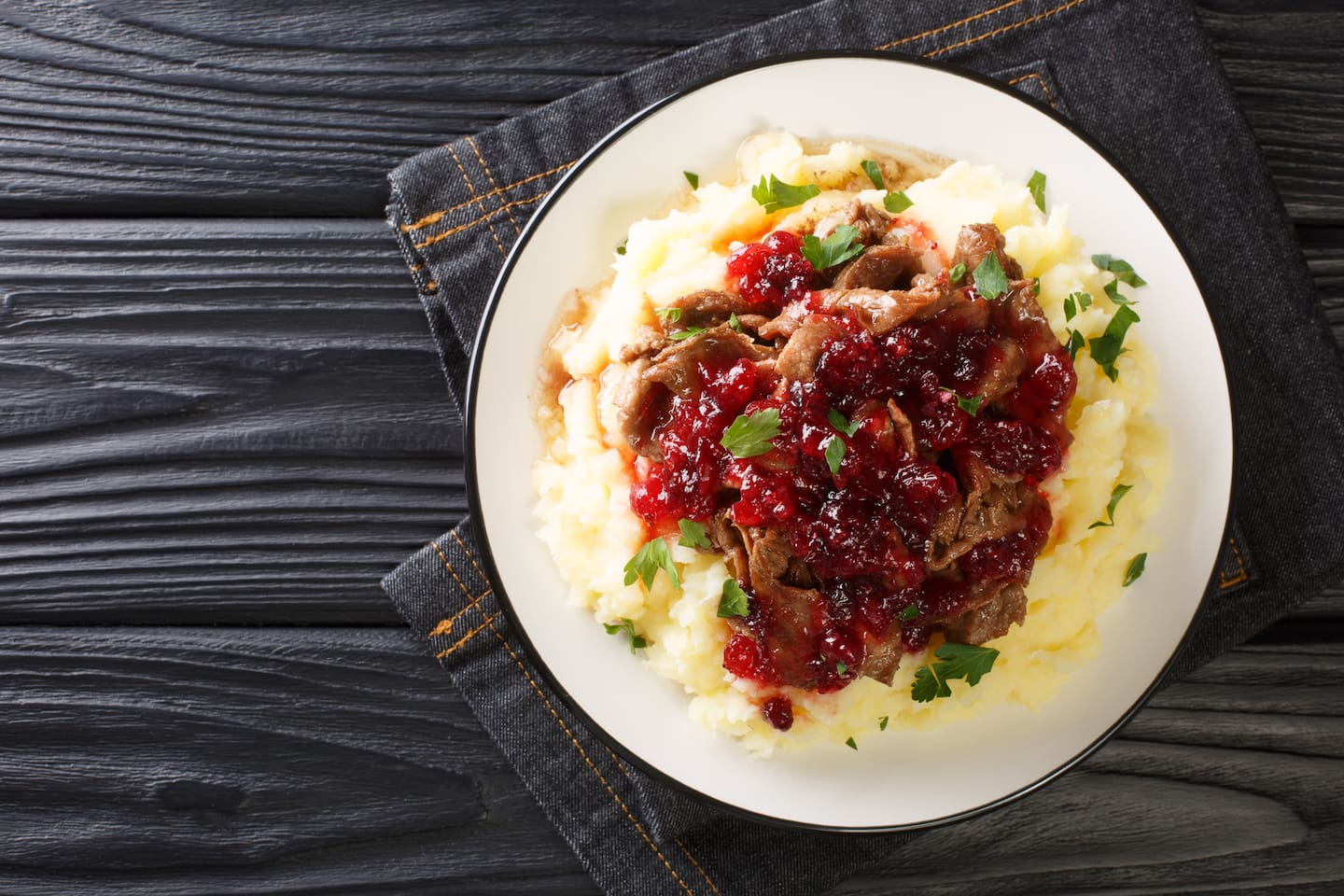 The Finnish word for reindeer stew, "Poronkäristys," is a traditional dish served with lingonberry sauce and mashed potatoes. Photo / 123rf