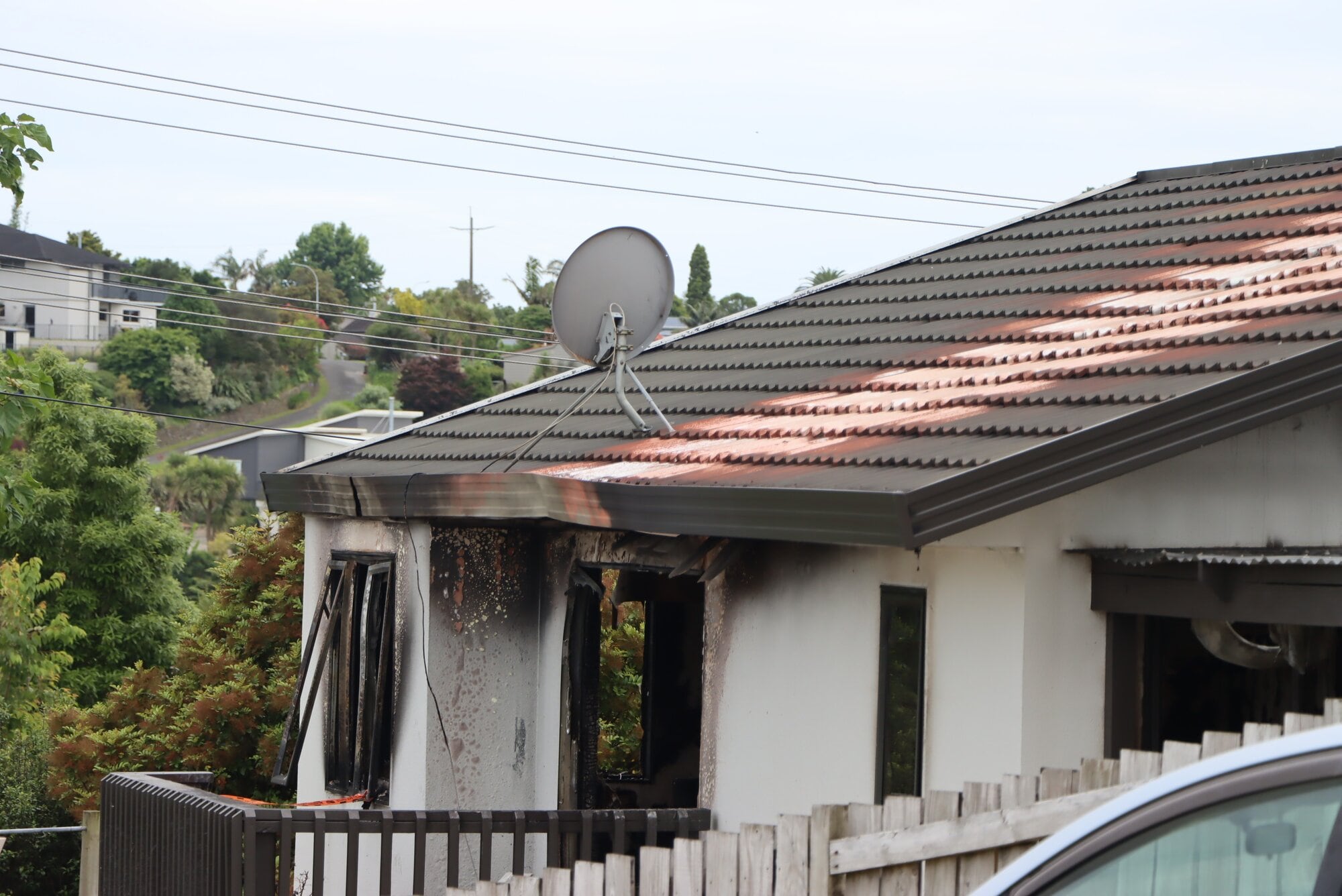 Extensive fire damage is evident across the interior and exterior of the property. Photo / Kaitlyn Morrell
