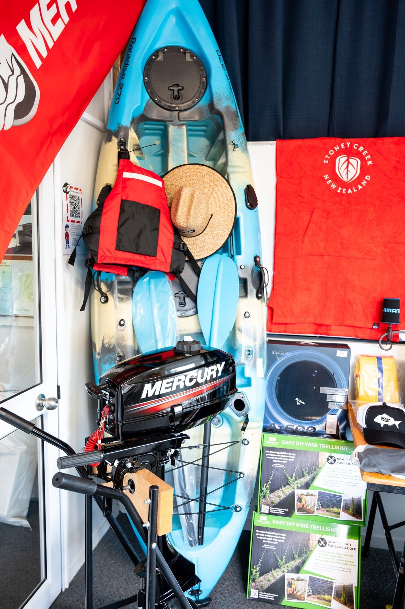 Prizes in the Tauranga Coastguard fishing competition include a Mercury 3.3 outboard motor from The Boat Place and a kayak. Photo / Brydie Thompson.