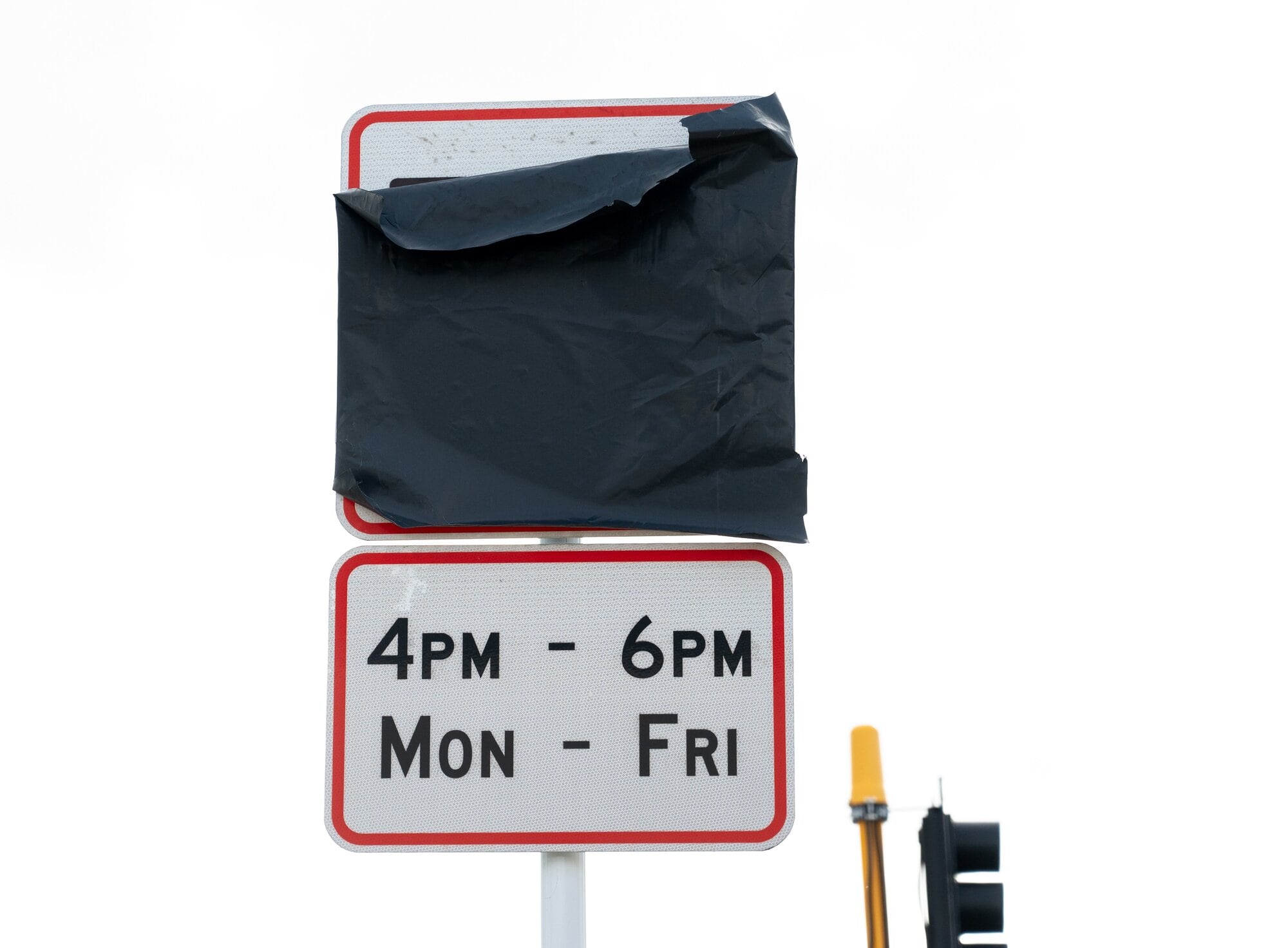A covered-up bus lane sign on Cameron Rd. Photo / Brydie Thompson