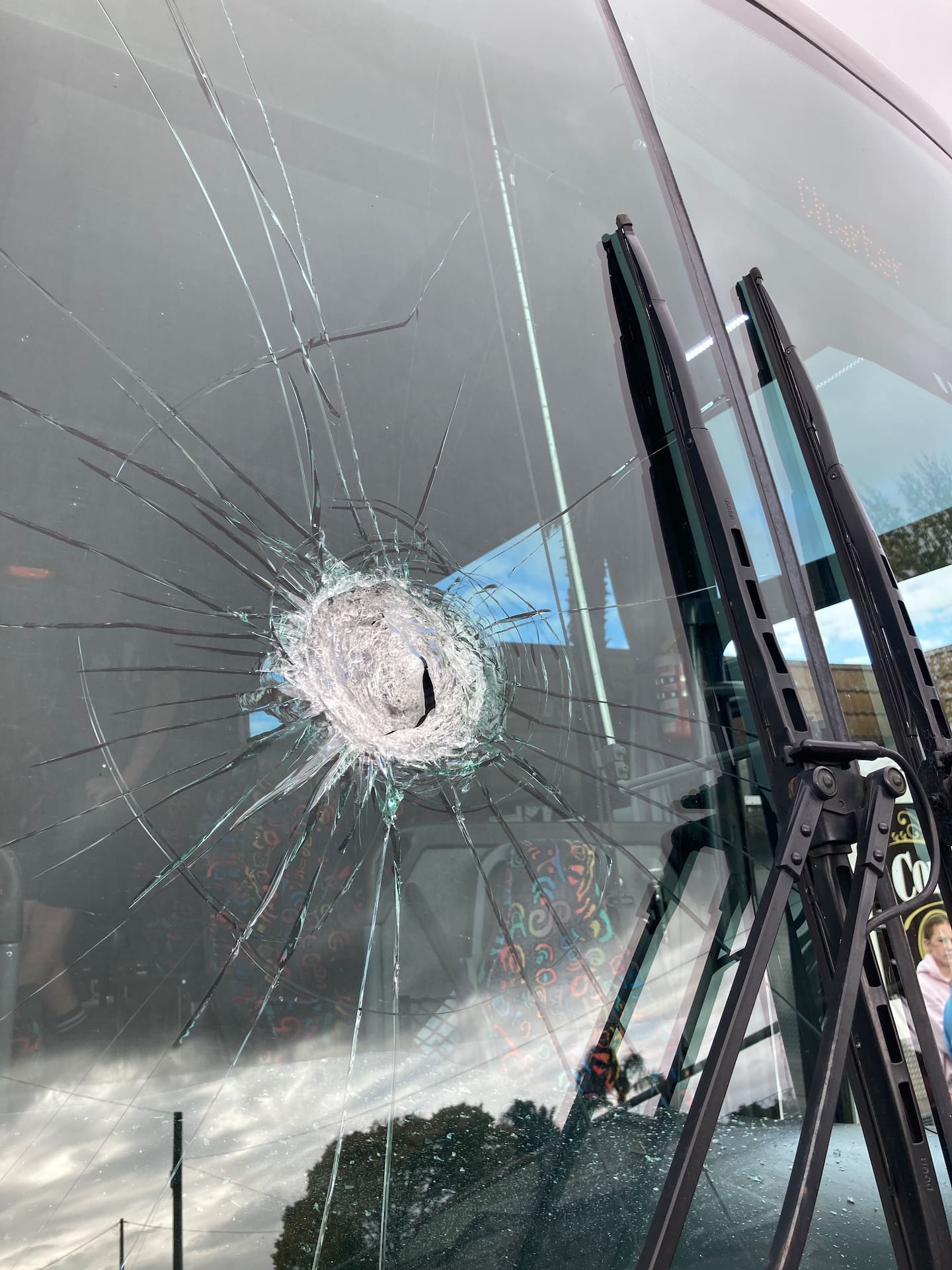 The bus driver says he was 'showered with glass'.