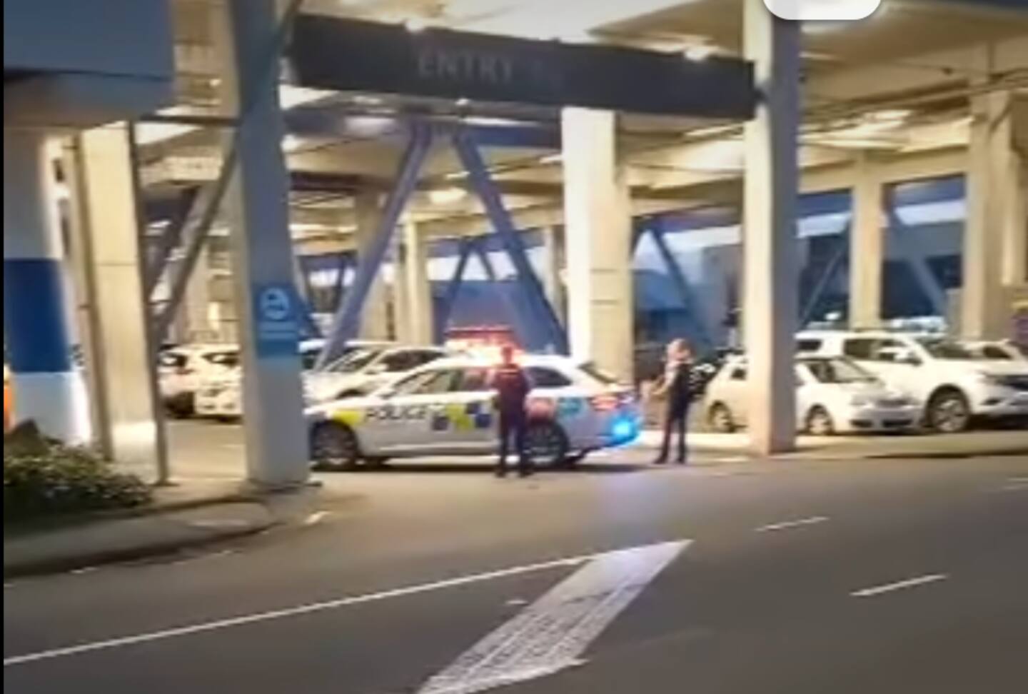 Several armed officers and police vehicles can be seen at the LynnMall shopping centre in the suburb of New Lynn, Auckland.