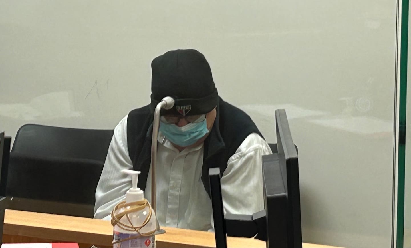 Auckland man Murray Sakey initially tried to hide his face with a mask in the Waitakere District Court. Photo / Katie Harris