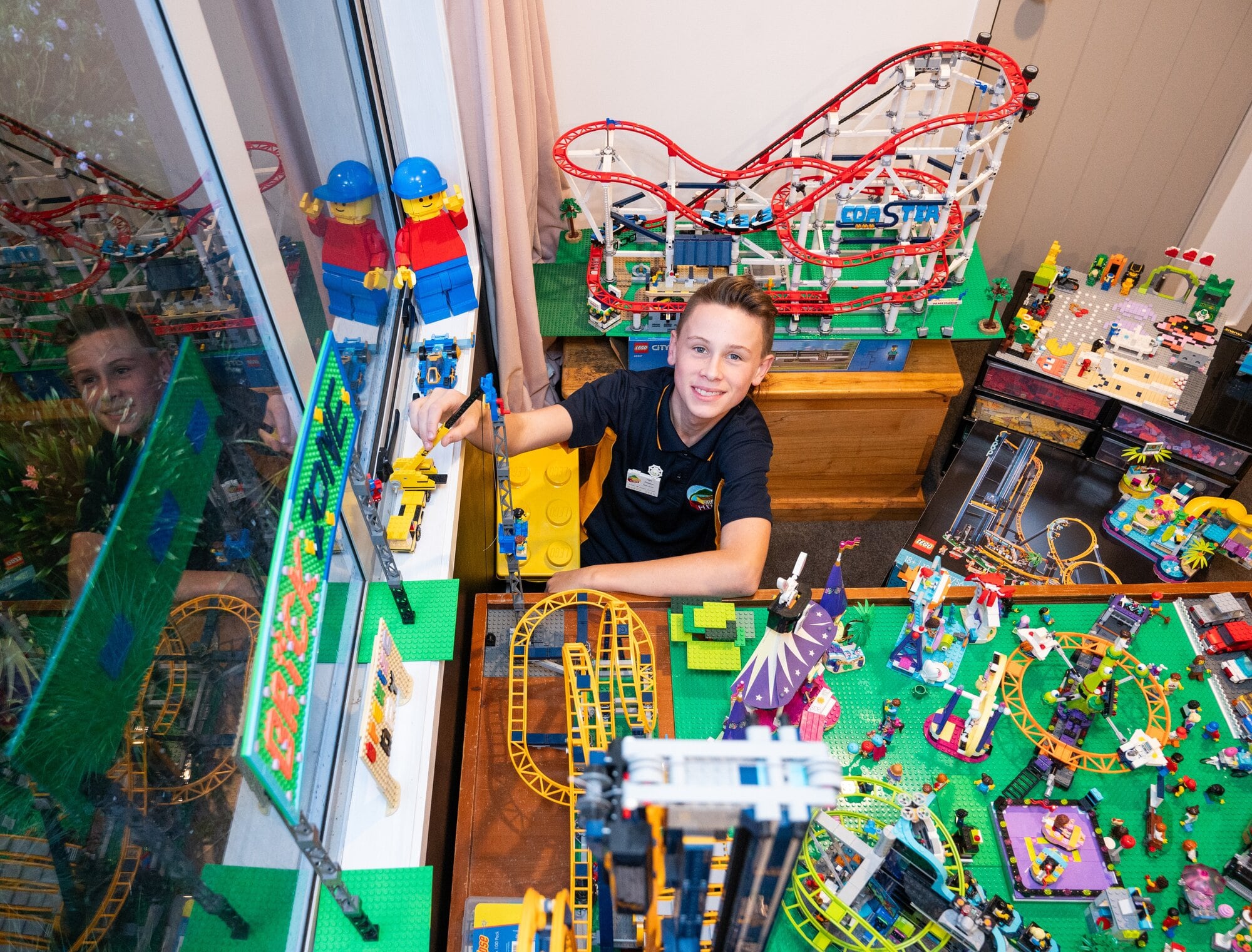  Nate Dawson, 13, with the fairground masterpiece he created with his brother Fraser Daw-son, 11, that will be on display at at the June 14-15 show. Photo / Brydie Thompson