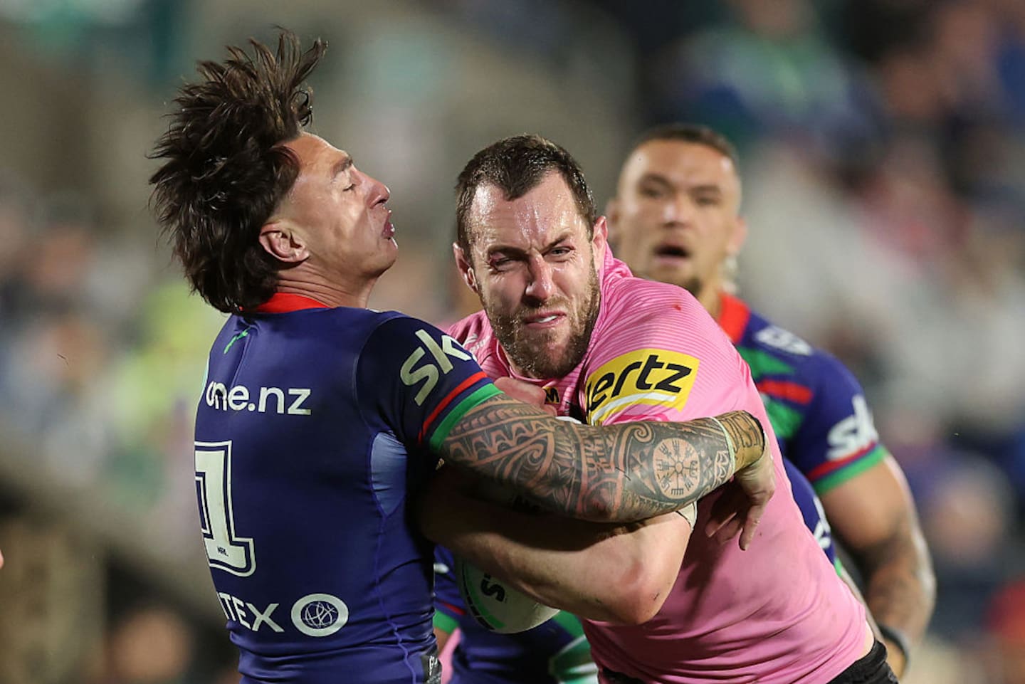 Penrith's Isaah Yeo bumps off Charnze Nicoll-Klokstad. Photo / Getty Images