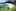 Whale Bay, Northland: An idyllic white sand beach fringed by native ferns and pōhutukawa.