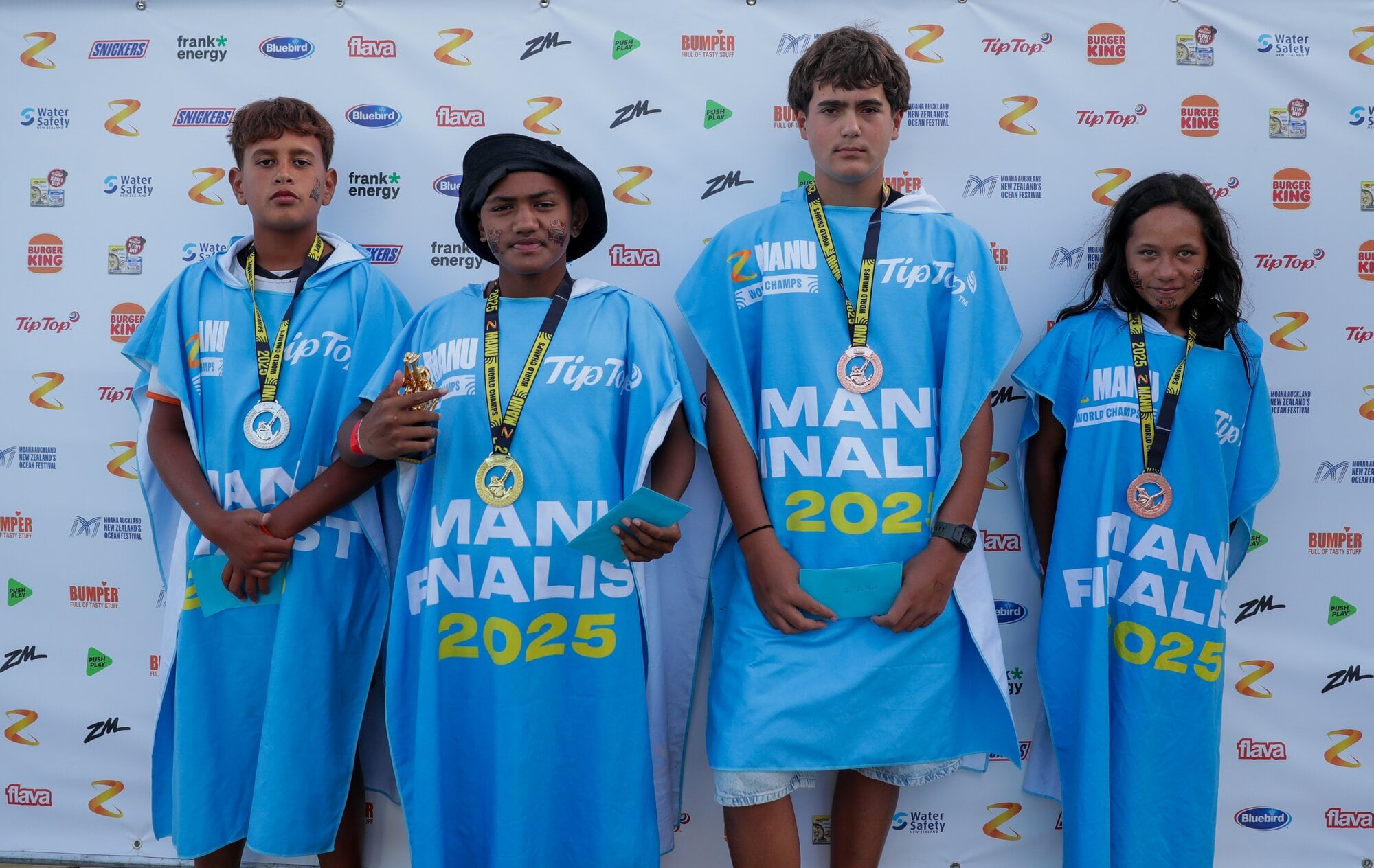 Kids male medallists Te Koha Burton (left, silver), Ngawiki Taka (gold), Kadyn Kanohi (bronze), and kids female bronze medallist Tawhai Rakich. Photo / Blinkshot Photography, Zach Quin