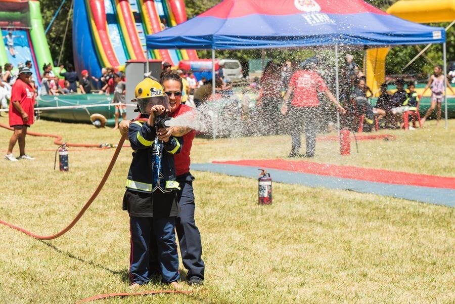 Fire and Emergency New Zealand demonstrating how to blast the hoses. Photo / Supplied